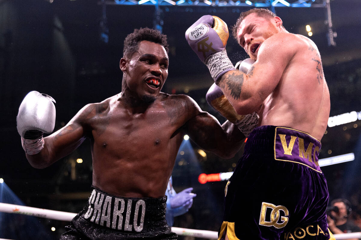 Jermell Charlo gets a punch in on Canelo Alvarez during an undisputed world super middleweight ...