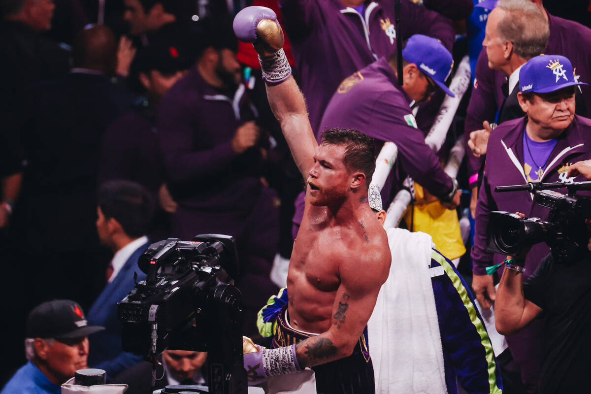 Canelo Alvarez pumps his glove into the air after beating Jermell Charlo during an undisputed w ...