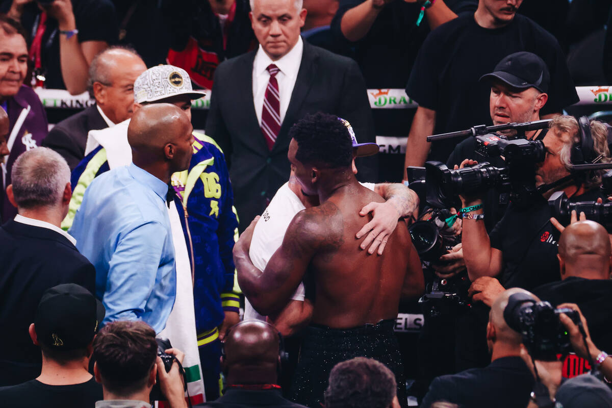 Canelo Alvarez and Jermell Charlo hug after boxing in an undisputed world super middleweight ti ...