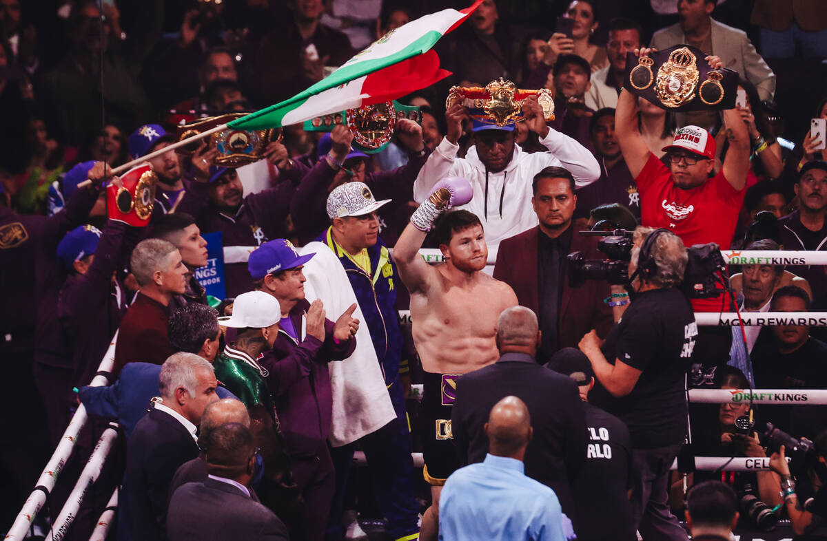 Canelo Alvarez pumps up his fans during an undisputed world super middleweight title boxing bou ...