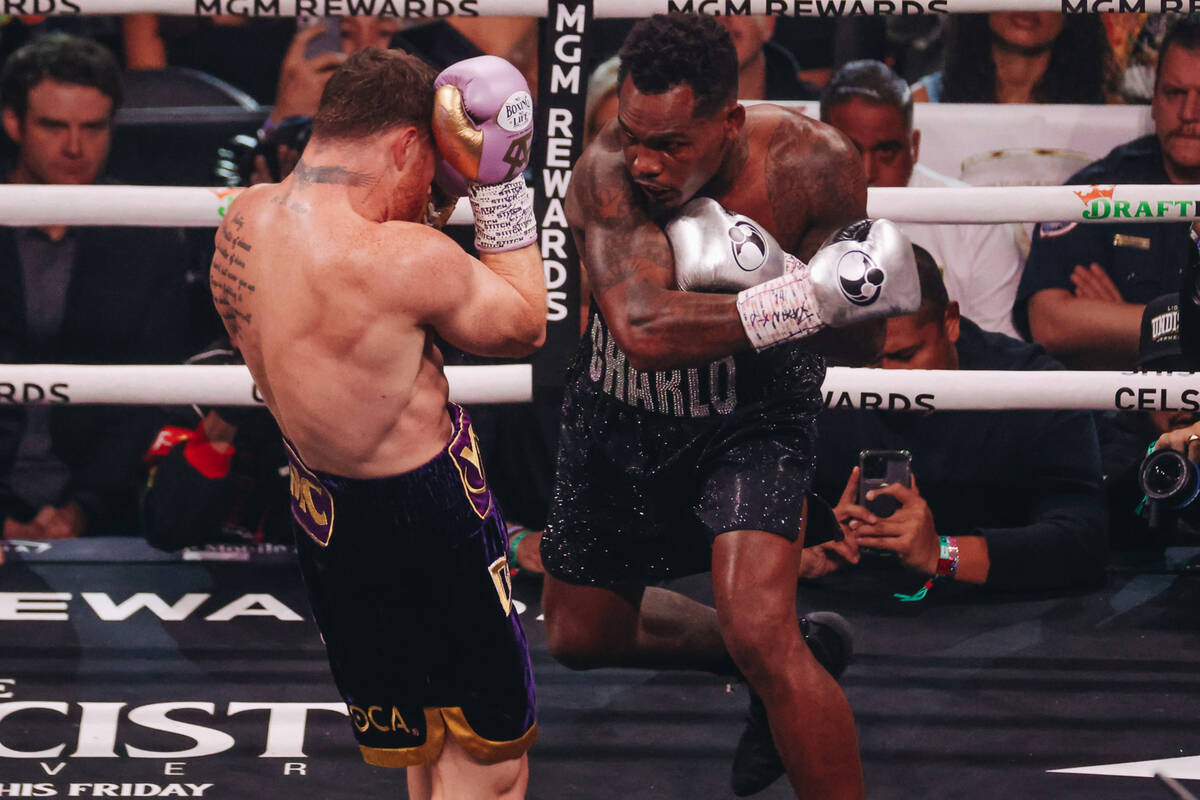 Jermell Charlo punches Canelo Alvarez during an undisputed world super middleweight title boxin ...