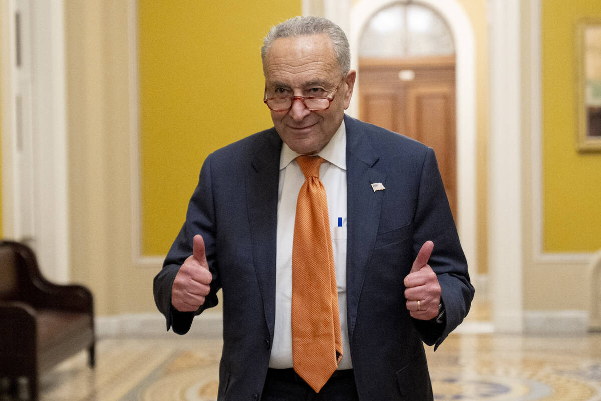 Senate Majority Leader Chuck Schumer, D-N.Y., gives two thumbs up as the Senate votes to approv ...