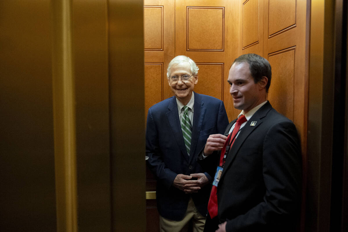 Senate Minority Leader Mitch McConnell, R-Ky., leaves after voting to approve a 45-day funding ...