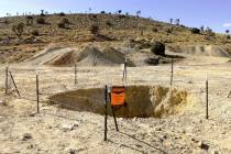 An exposed mine shaft in Clark County that state abandoned mine officials had previously backfi ...