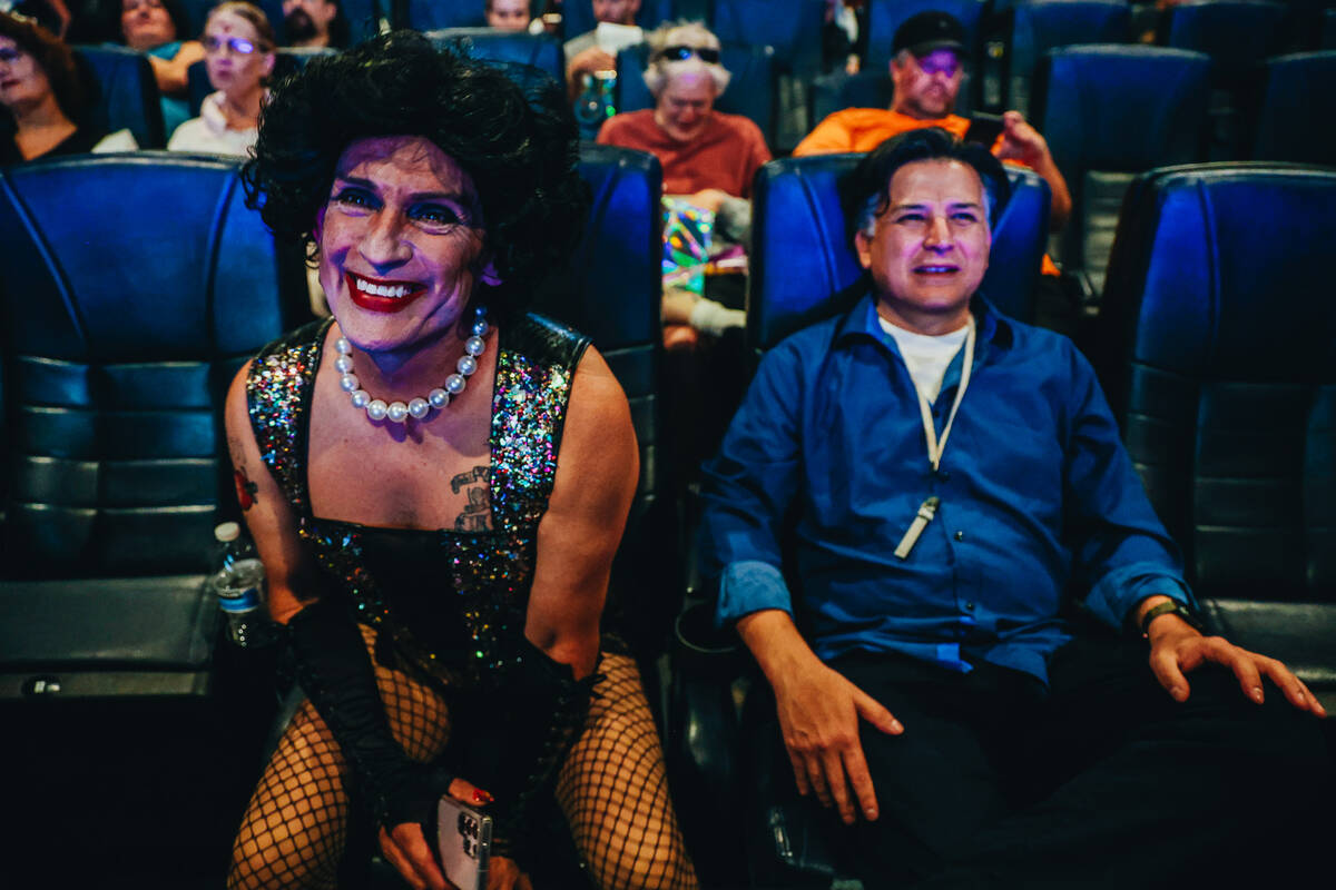 Dressed as Frank-N-Furter, Anthony Kendall, left, gets excited for showing of “Rocky Hor ...