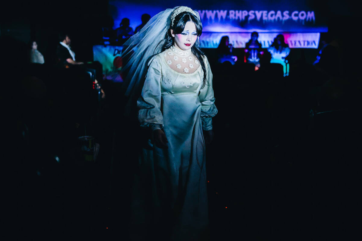 Stella Finnegan walks back to her seat after participating in an audience costume contest durin ...