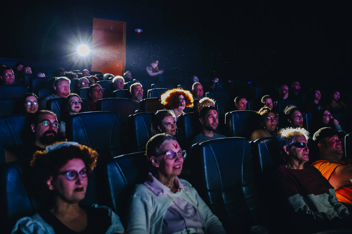 An audience watches a live action showing of “Rocky Horror Picture Show” at Tropi ...