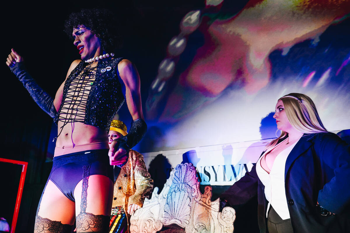 Frank-N-Furter, middle, sings “Sweet Transvestite” during a live action showing o ...