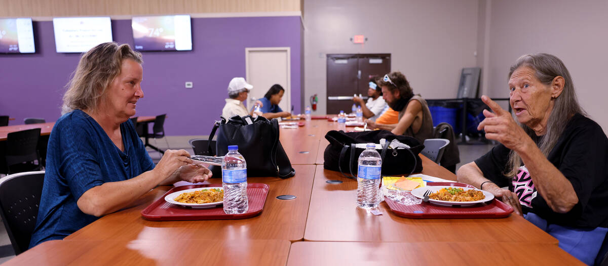 Brenda Cole, 71, right, and Lisa, who declined to give her last name, eat during the community ...