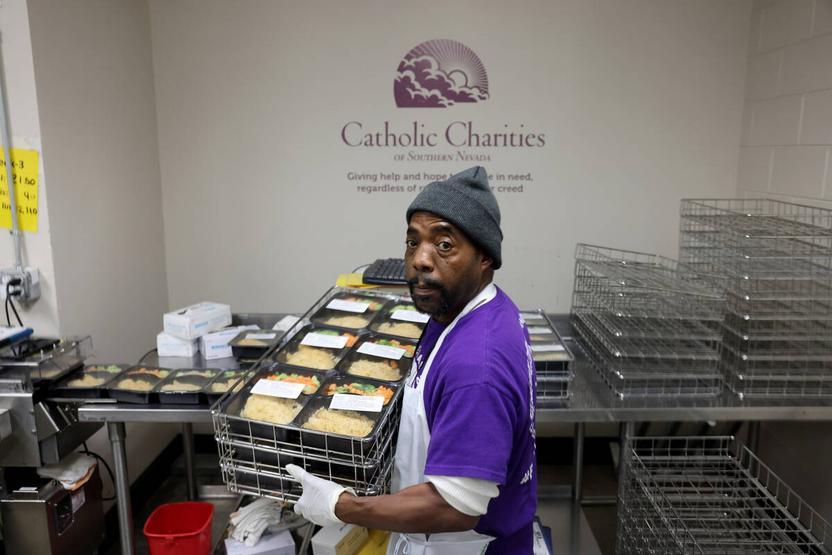 Anthony Hardwick Sr. makes meals for the meals on wheels program at Catholic Charities of South ...