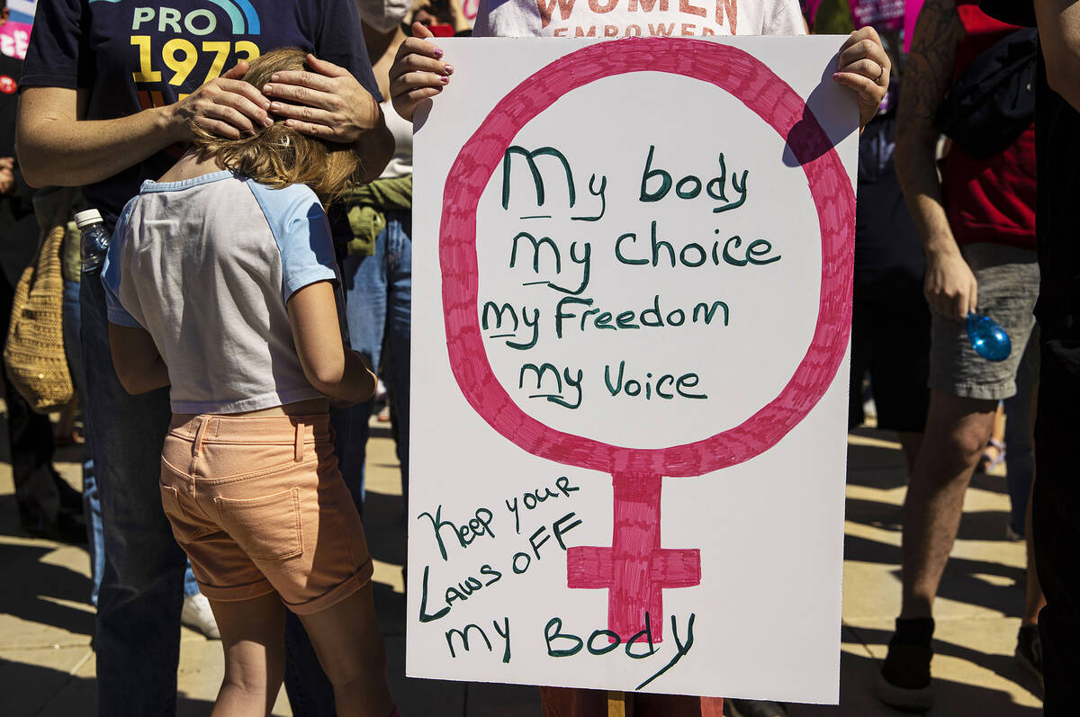 Demonstrators gather outside the Lloyd D George Courthouse during a March for Reproductive Righ ...