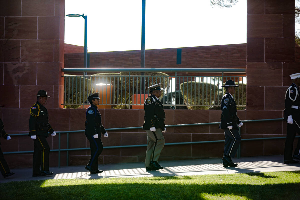 Members of the honor guard walk out of the 1 October Sunrise Remembrance ceremony at the Clark ...