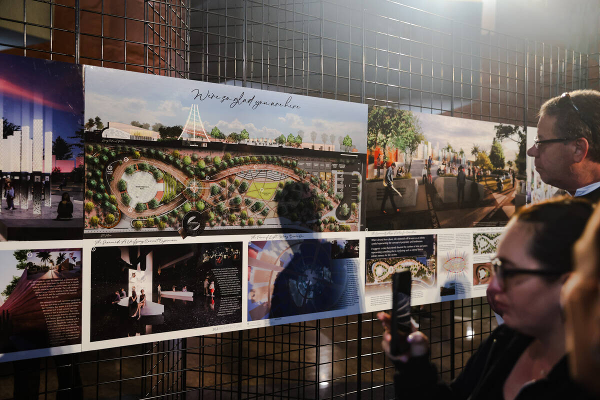 People look at depictions of the future memorial that will be on the festival grounds where 58 ...