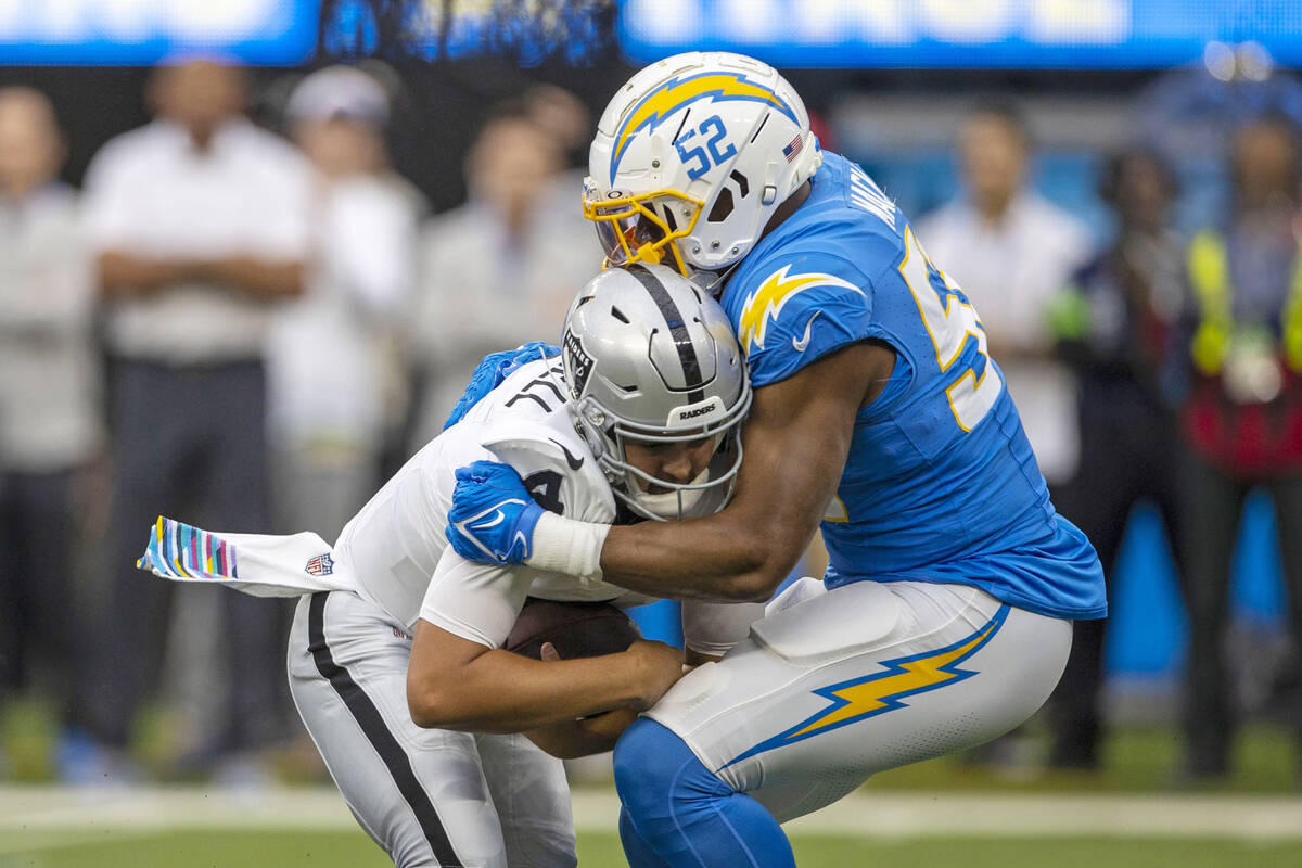 Los Angeles Chargers linebacker Khalil Mack (52) sacks Raiders quarterback Aidan O'Connell (4) ...