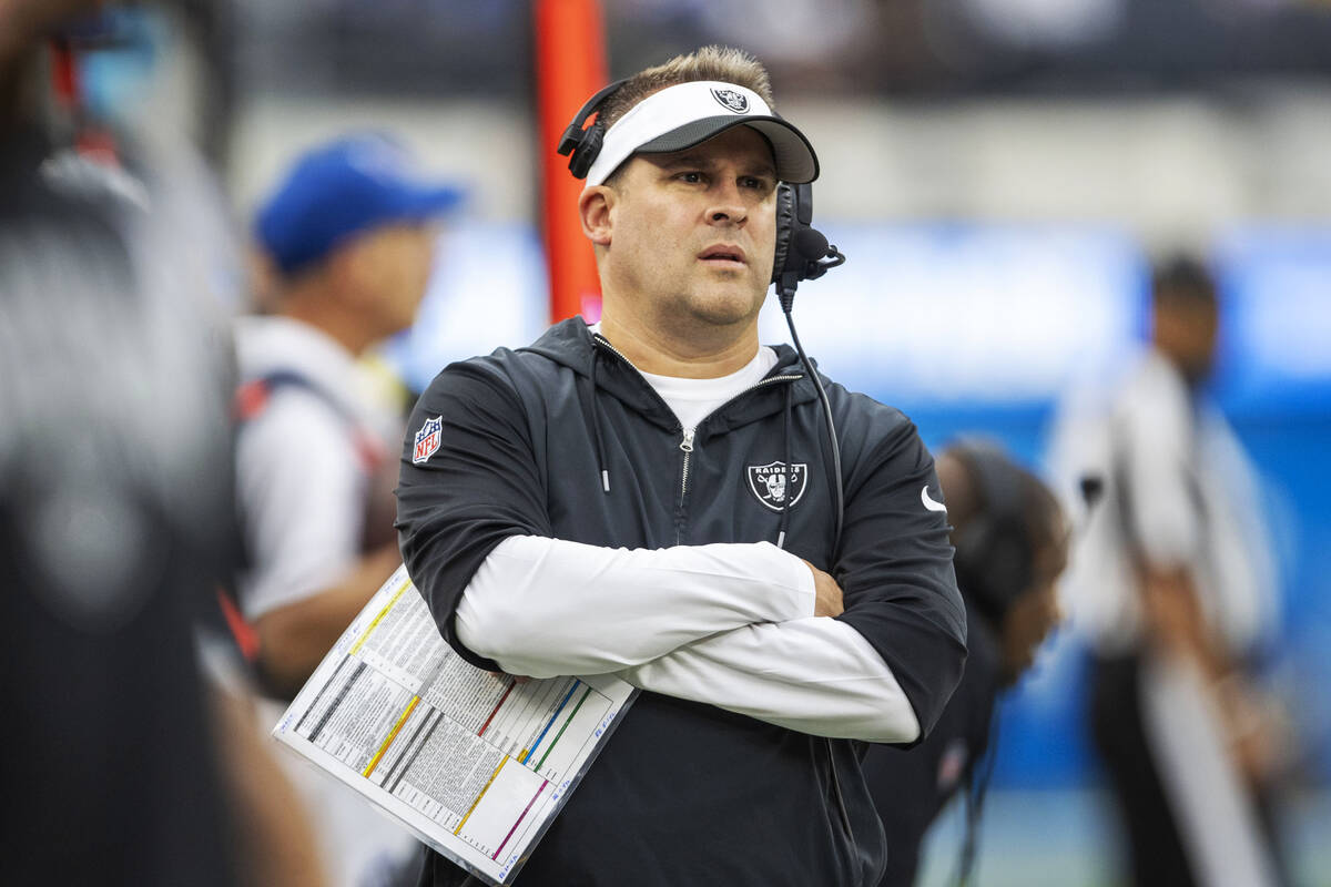 Raiders head coach Josh McDaniels observes from the sideline during the first half an NFL game ...