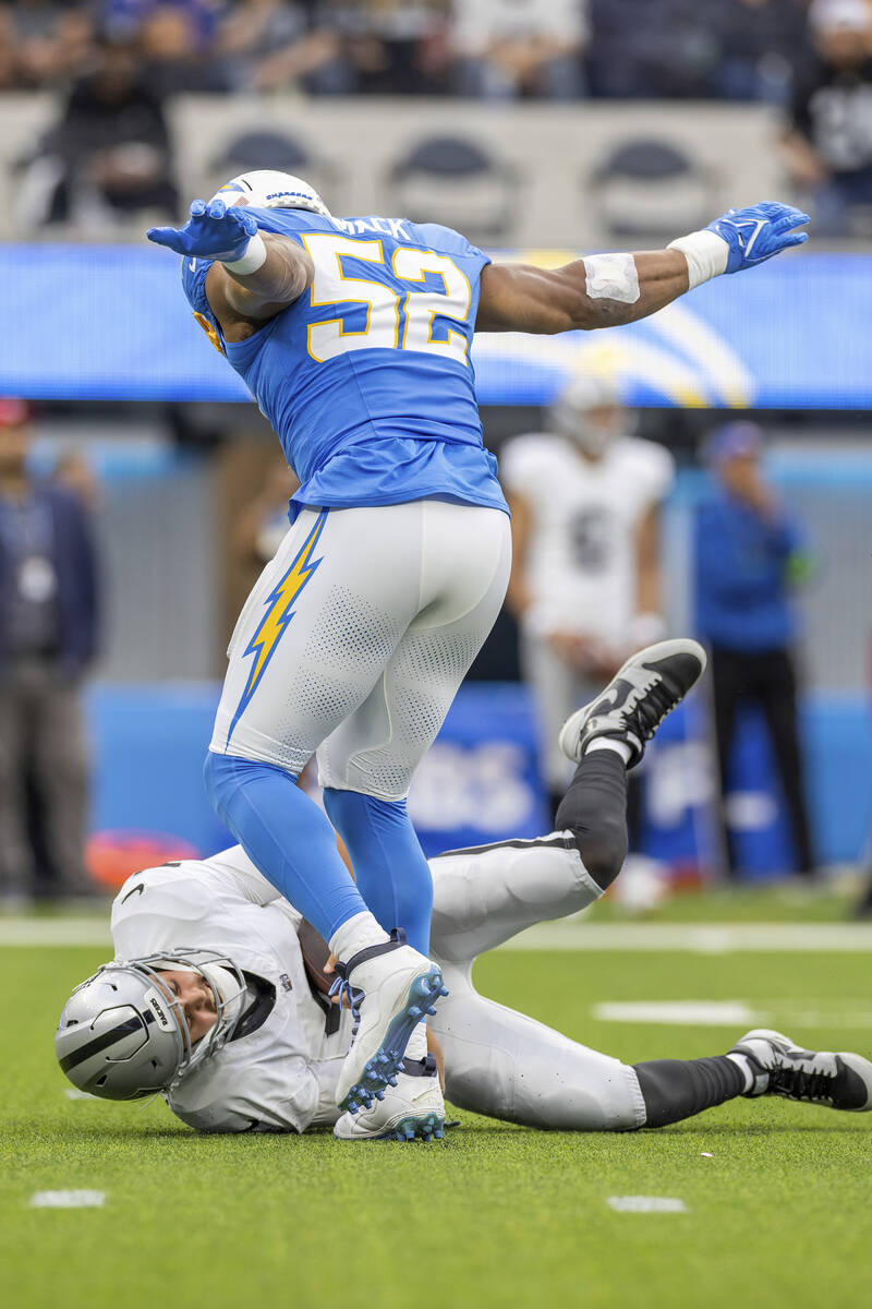 Los Angeles Chargers linebacker Khalil Mack (52) sacks Las Vegas Raiders quarterback Aidan O'Co ...