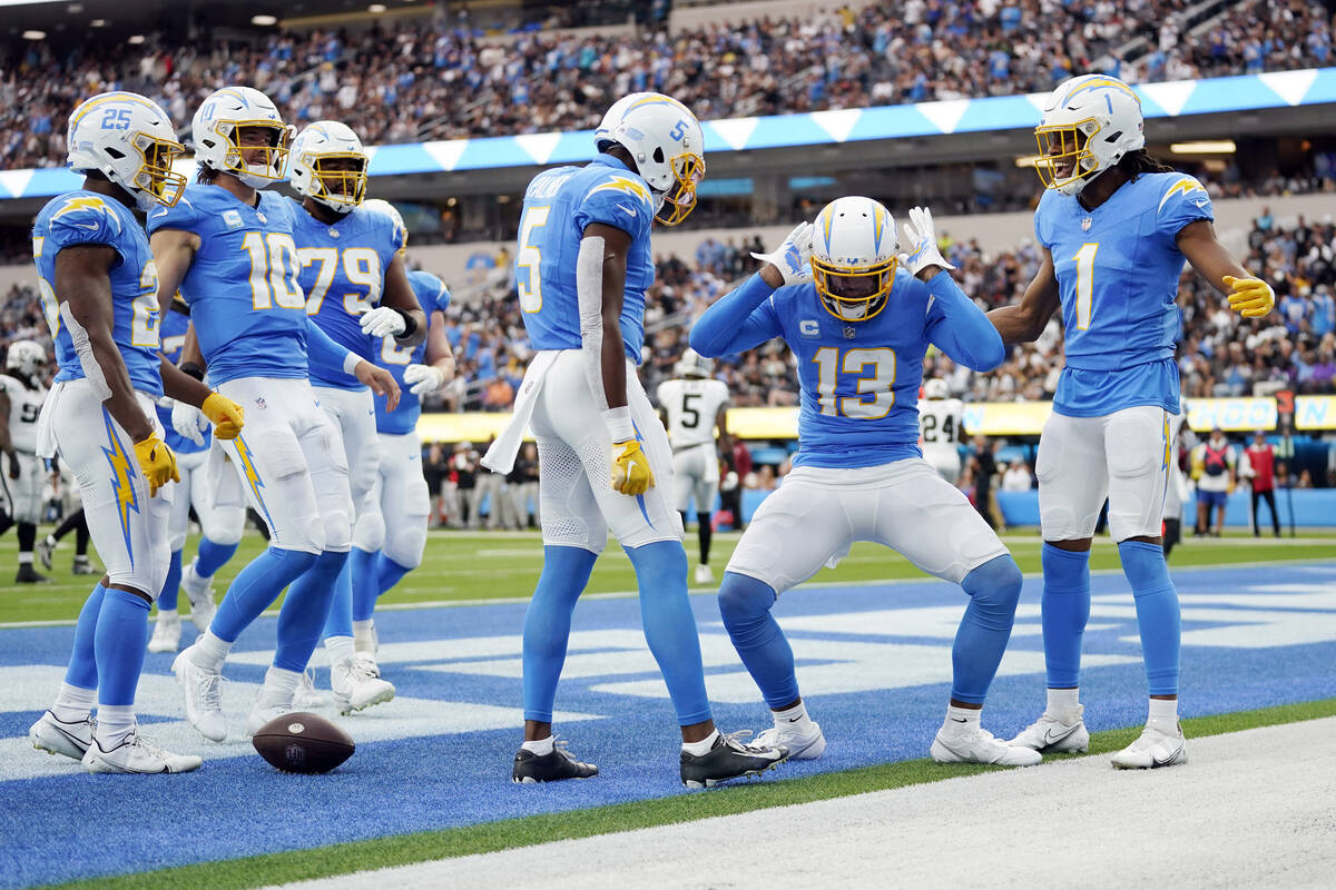 Los Angeles Chargers wide receiver Keenan Allen (13) celebrates his touchdown catch during the ...