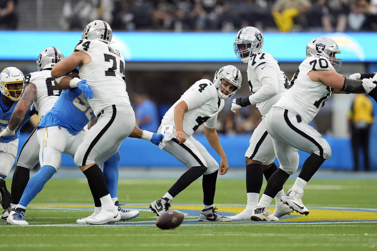 Las Vegas Raiders quarterback Aidan O'Connell (4) fumbles the football during the first half of ...