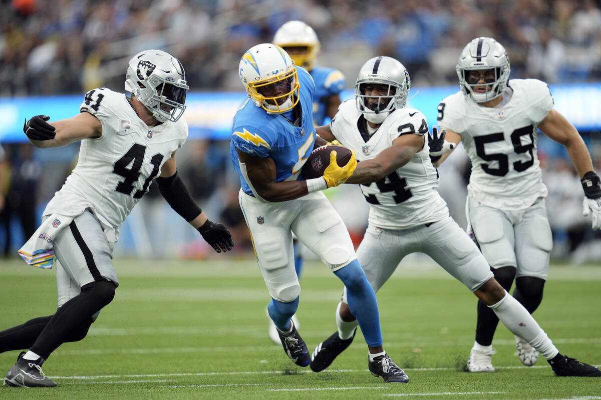 Los Angeles Chargers wide receiver Joshua Palmer runs after a catch against the Las Vegas Raide ...