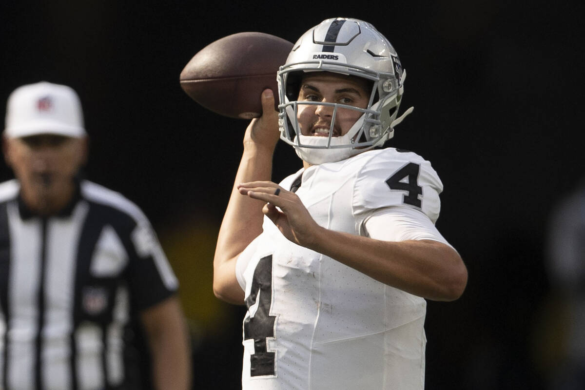 Raiders quarterback Aidan O'Connell (4) throws against the Los Angeles Chargers during the seco ...