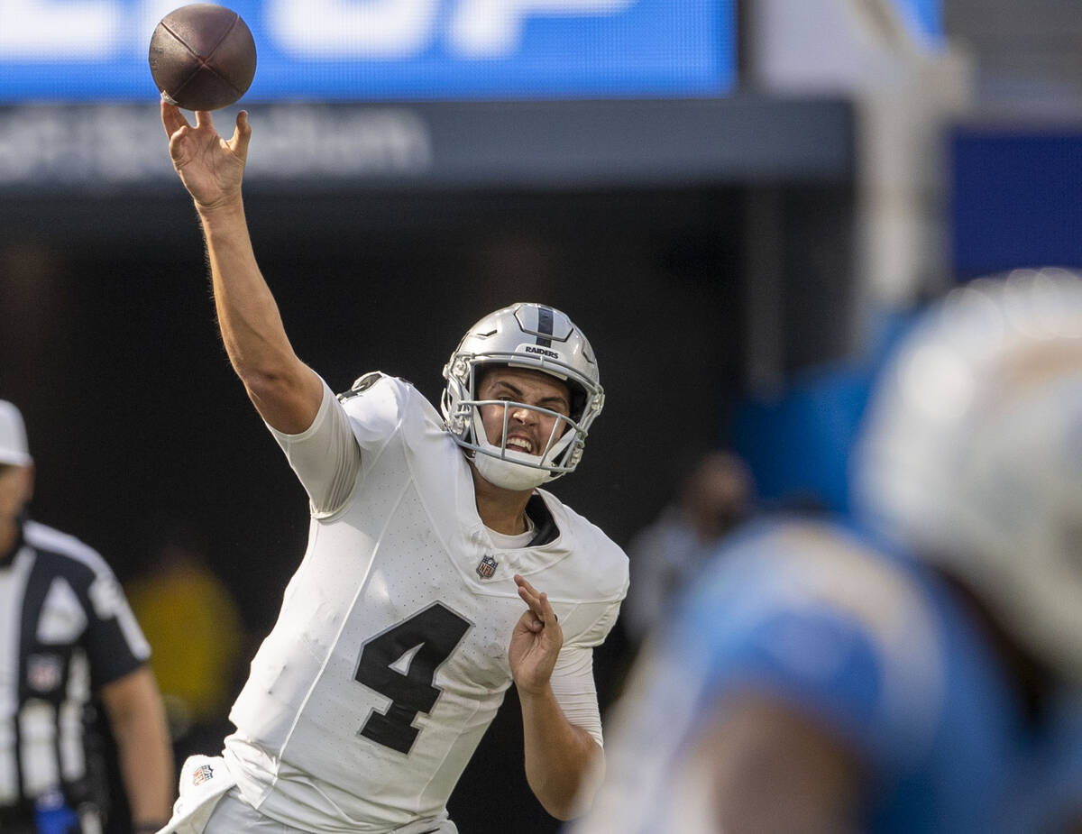 Raiders quarterback Aidan O'Connell (4) throws against the Los Angeles Chargers during the seco ...
