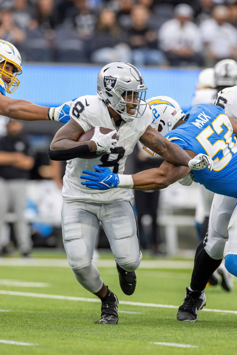 Las Vegas Raiders running back Josh Jacobs (8) runs the ball against the Los Angeles Chargers i ...