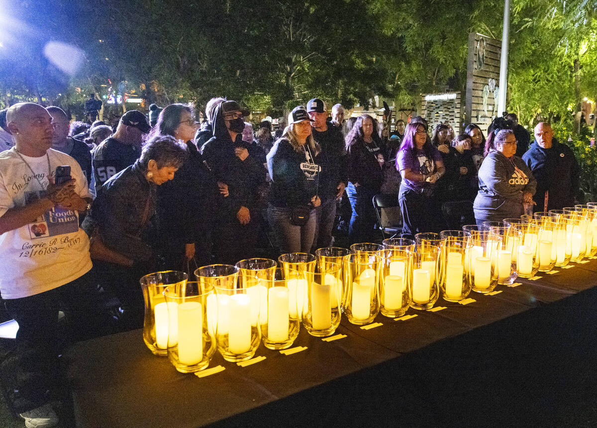 People gather at the Community Healing Garden for the reading of the names of the 1 October vic ...