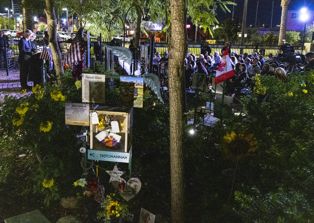 People gather at the Community Healing Garden as Mayor Carolyn Goodman and David Riggleman, Las ...