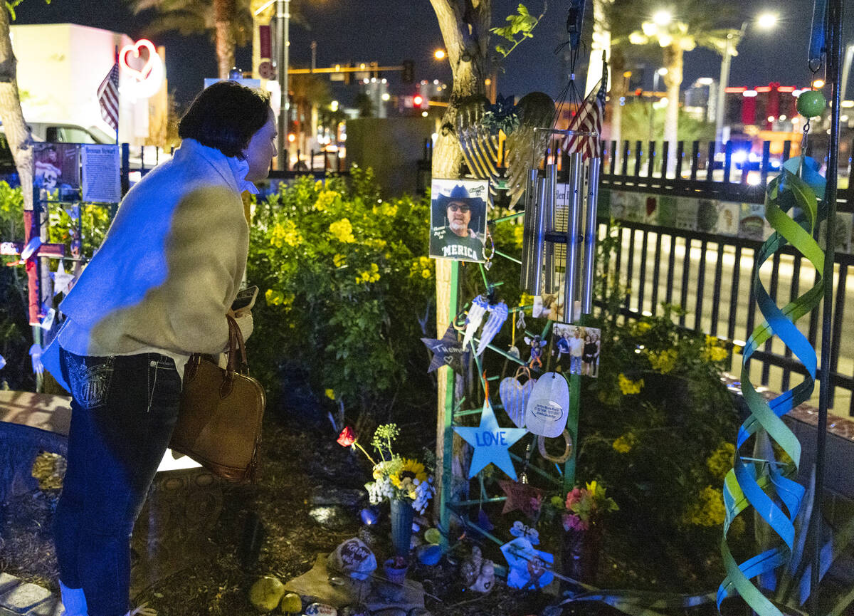 Clair DiPinto visits the Community Healing Garden prior to the reading of the names of the 1 Oc ...