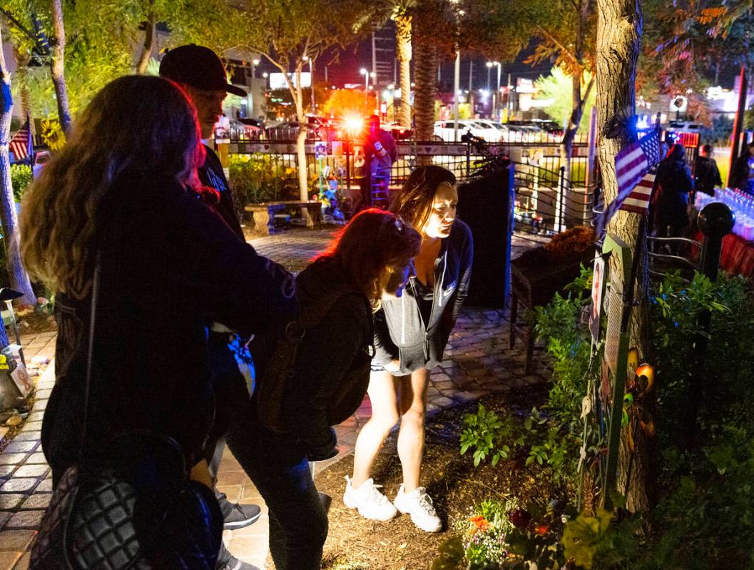 Family members of Cameron Robinson, a shooting victim, visit the Community Healing Garden prior ...