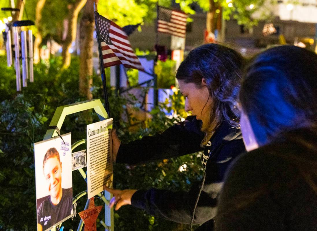 Family members of Cameron Robinson, a shooting victim, visit the Community Healing Garden prior ...