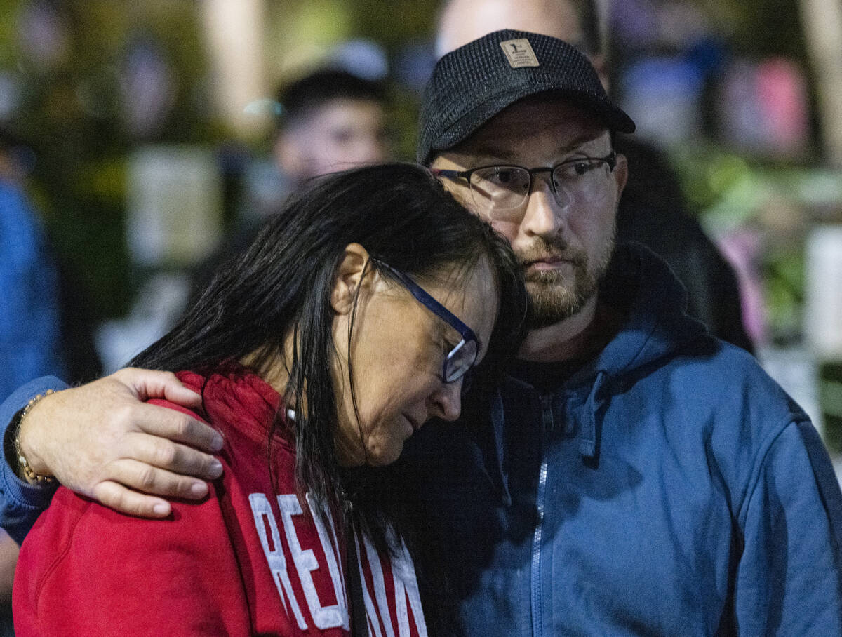 Kimberly Baker, the 1 October shooting survivor, is comforted by her husband Petr Terentev as M ...