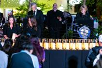 Candles are lit as Mayor Carolyn Goodman, right, and David Riggleman, Las Vegas communications ...