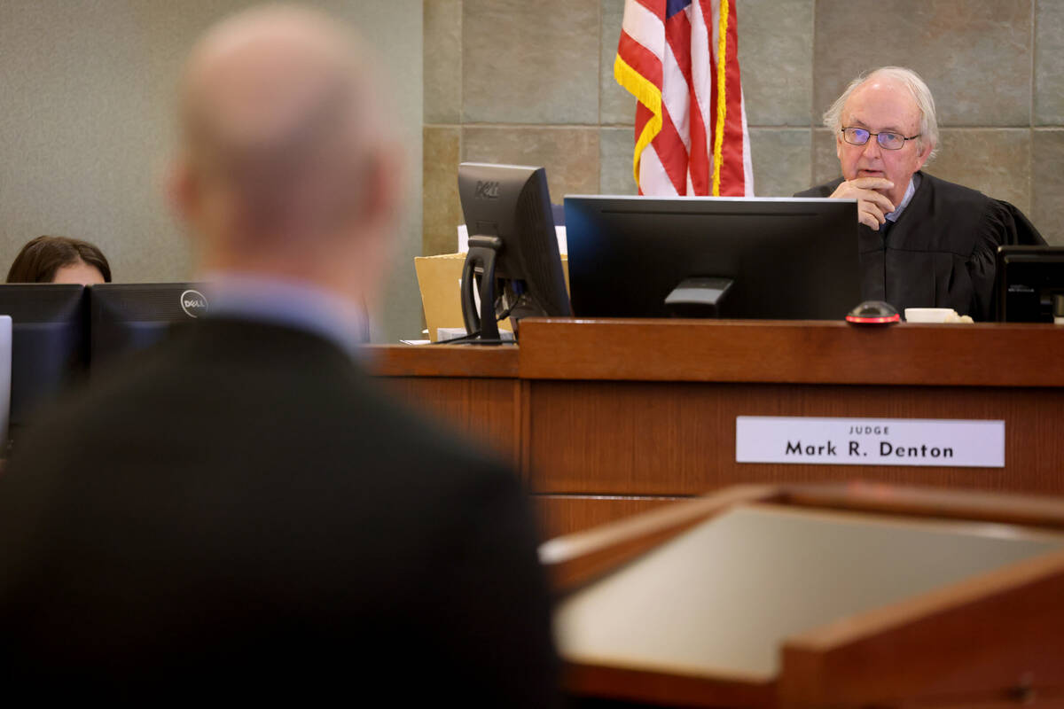 Clark County District Court Judge Mark Denton listens to William Schuller, an attorney represen ...