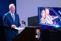 A photograph of rapper Tupac Amaru Shakur, right, is displayed as Clark County District Attorne ...