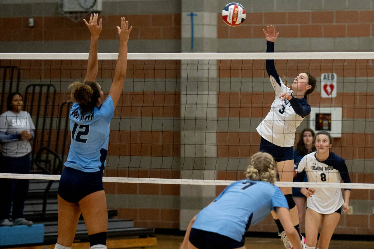 Shadow Ridge's Elaina Smith (3) makes a hit in their game against Foothill High School on Thurs ...