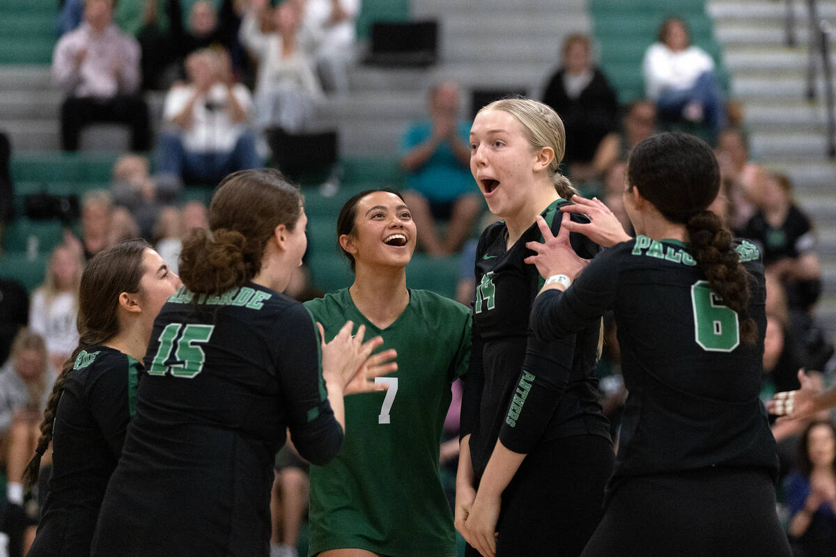 Palo Verde congratulates their Kate Camp (14) on a kill during a high school volleyball game ag ...