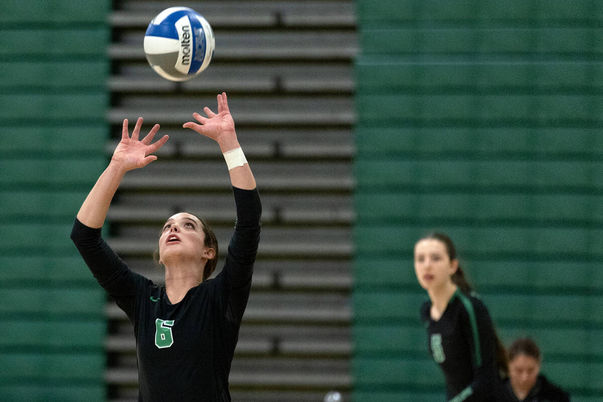 Palo Verde’s Emma Neville sets the ball during a high school volleyball game against Lib ...