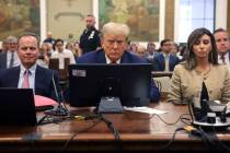 Former President Donald Trump listens during his civil fraud trial at the State Supreme Court b ...