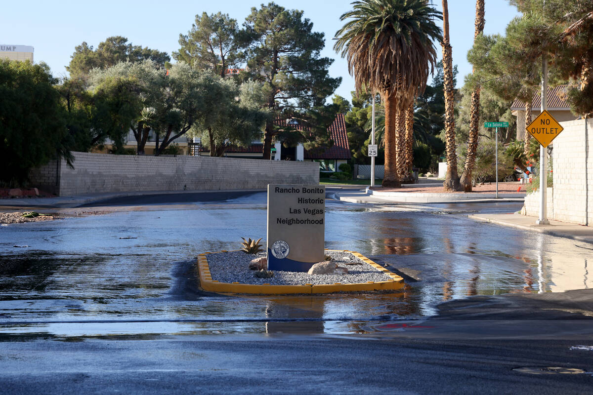 Water is seen on the roadway on Oakey Boulevard at Villa De Conde Way in Las Vegas on Wednesday ...