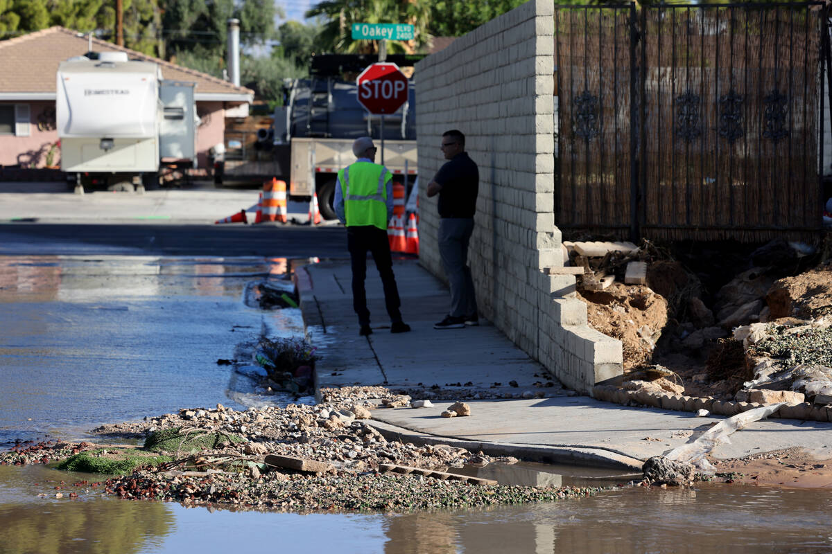 Water is seen on the roadway at Villa De Conde Way and Las Solana Way in Las Vegas on Wednesday ...