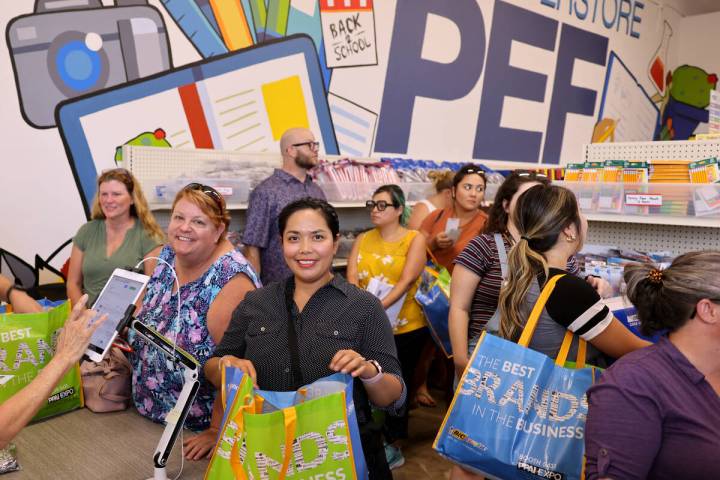 Ethelene Robles, center, a kindergarten teacher at Dickens Elementary, shops at the newest Publ ...