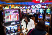 Elvis tribute artist Bobby Presley, of Modesto, Calif., sits by slot machines at CasaBlanca Res ...