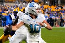 North Carolina quarterback Drake Maye (10) looks to throw a pass from the end zone during the s ...