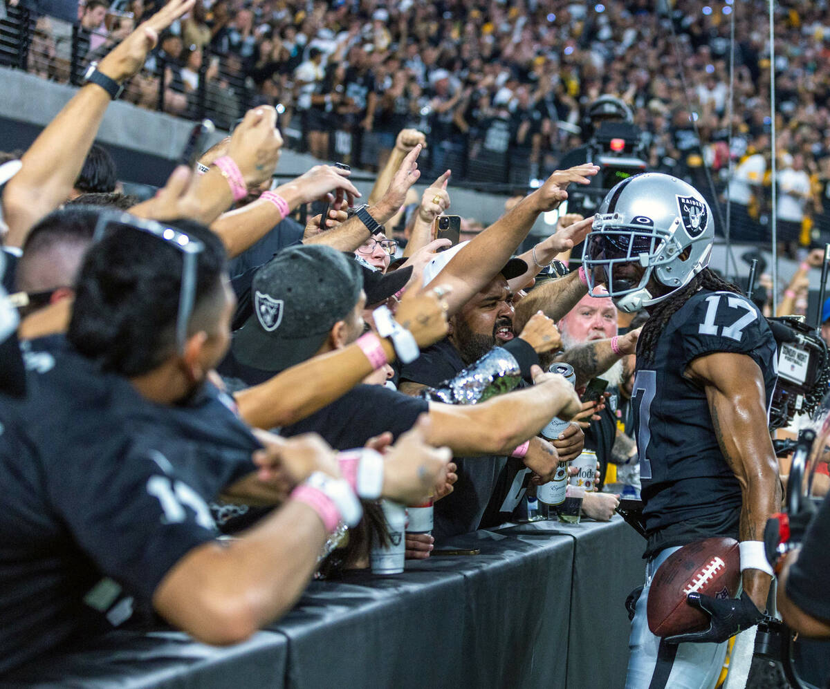 Raiders wide receiver Davante Adams (17) celebrates a touchdown catch against the Pittsburgh St ...