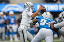 Los Angeles Chargers linebacker Chris Rumph II (94) comes in to sack Raiders quarterback Aidan ...