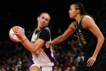 Los Angeles Sparks forward Dearica Hamby (5), a former Aces player, moves the ball past Las Veg ...