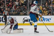 Golden Knights left wing Paul Cotter (43) and Colorado Avalanche center Nathan MacKinnon (29) f ...
