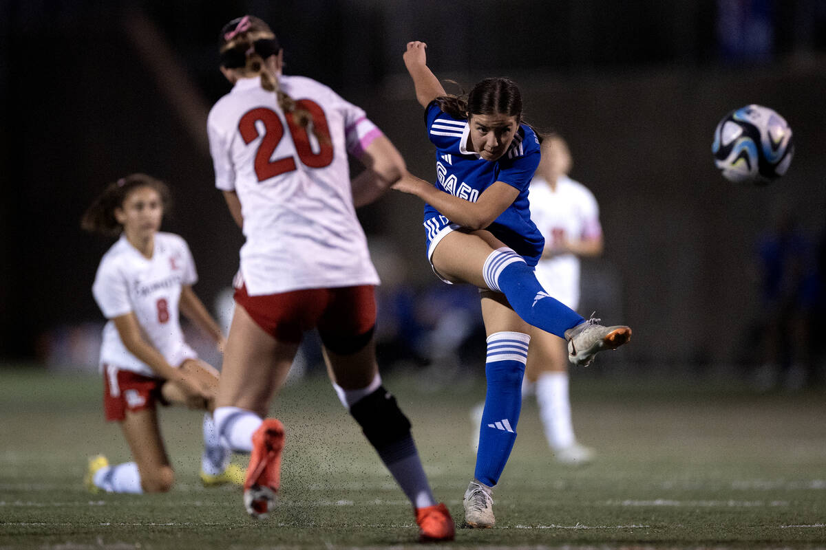 Bishop Gorman's Stephenie Hackett (10) attempts a goal while Liberty defender Madisyn Marchesi ...