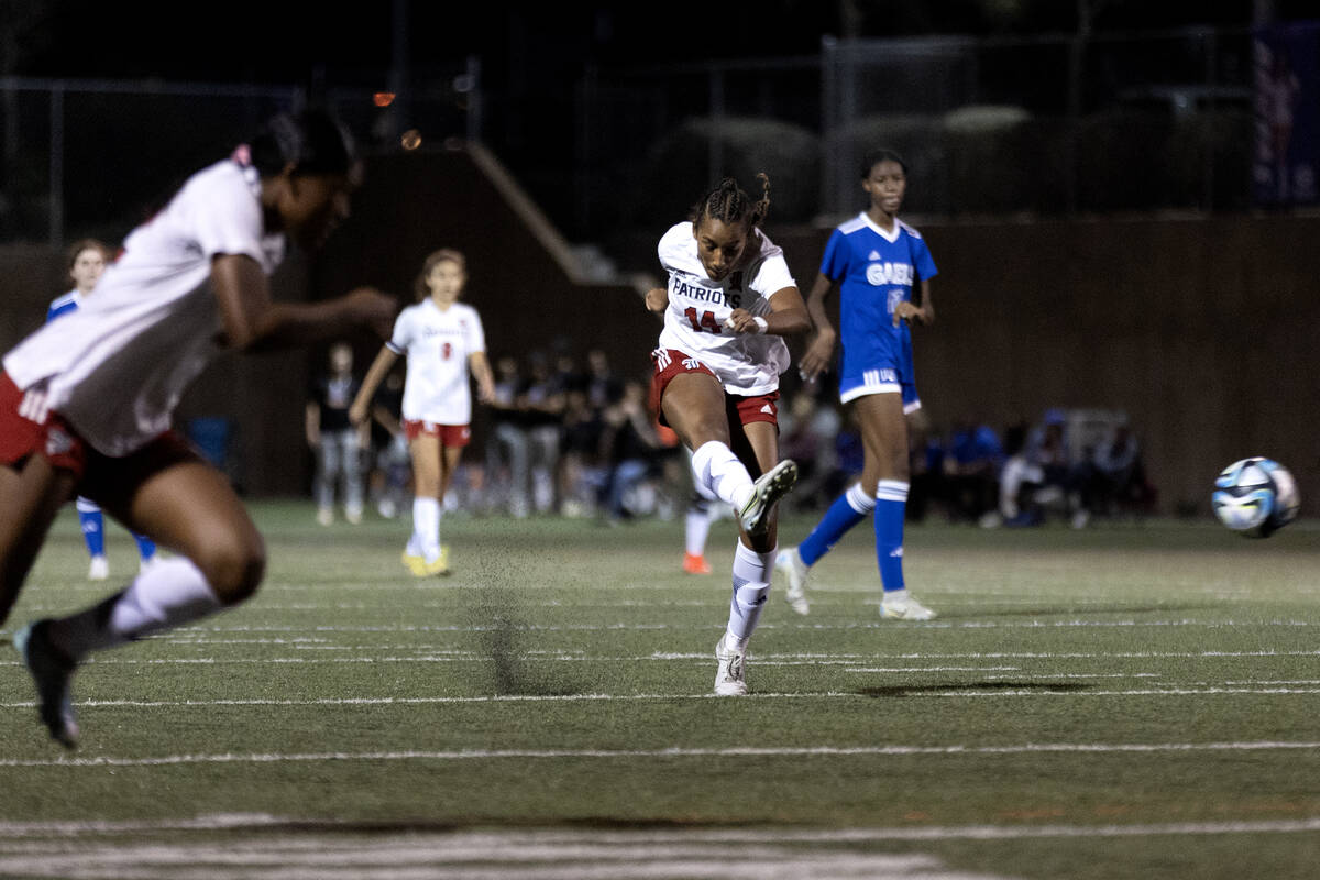 Liberty's Ayva Jordan (14) attempts a goal during a high school soccer game against Bishop Gorm ...